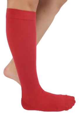 Red knee-high socks worn by a person on a white background